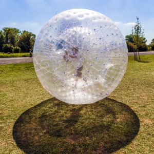 boy has fun in the Zorbing Ball
